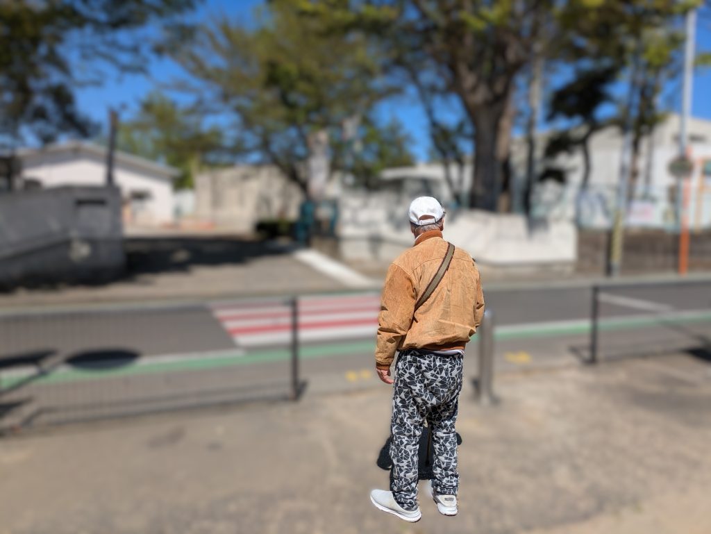 A caregiver accompanying an elderly man on a supervised walk.